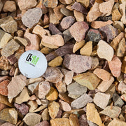 Color sample card surrounded by multicolored stones