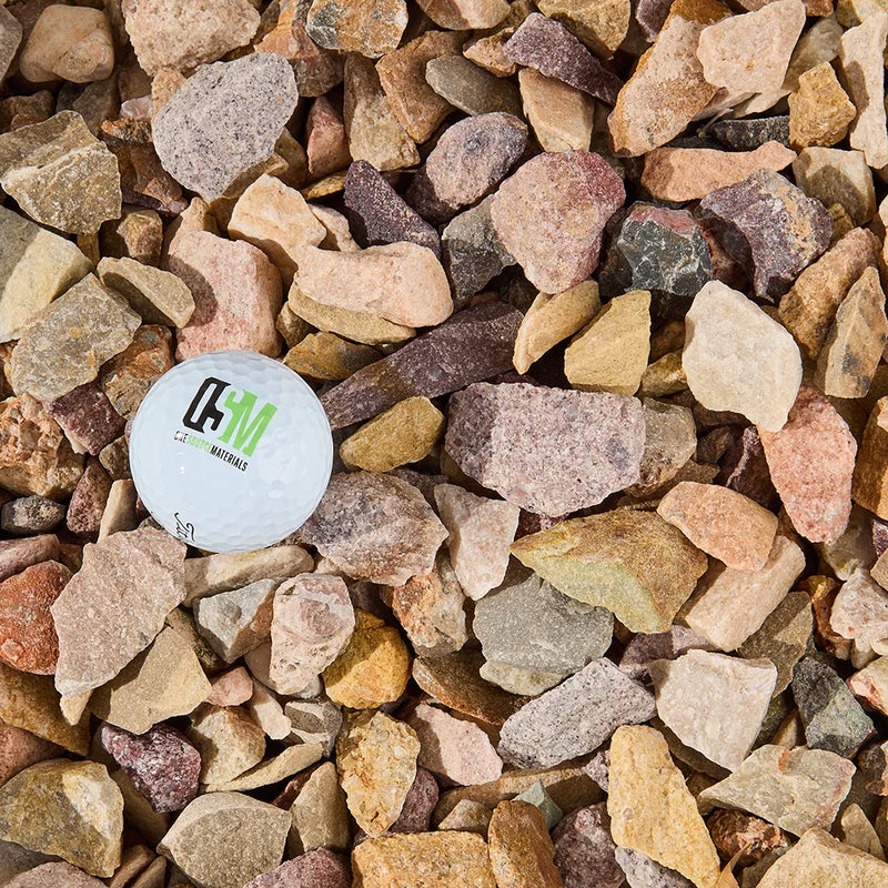 Color sample card surrounded by multicolored stones