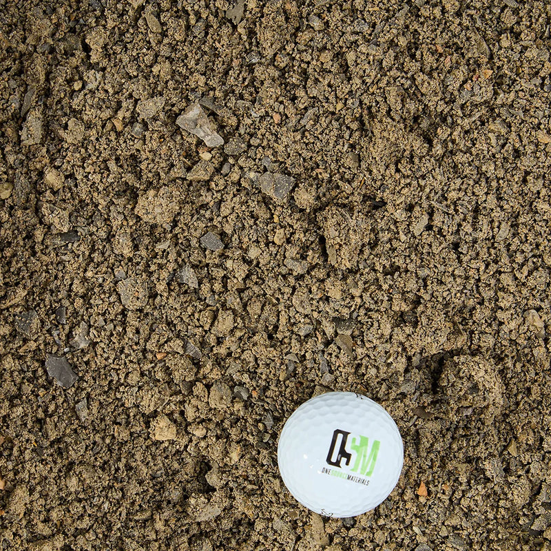 Crusher fines with a golf ball for scale