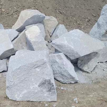 Gray stone blocks on a dirt ground