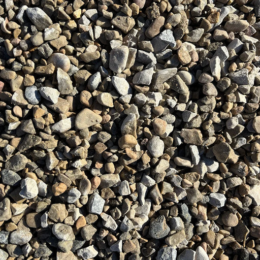 Close-up of small pebbles in various shades of brown, gray, and white.