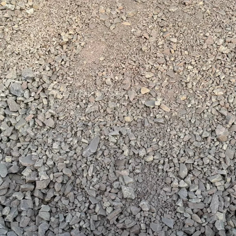 Close-up of small gravel stones on a brown background