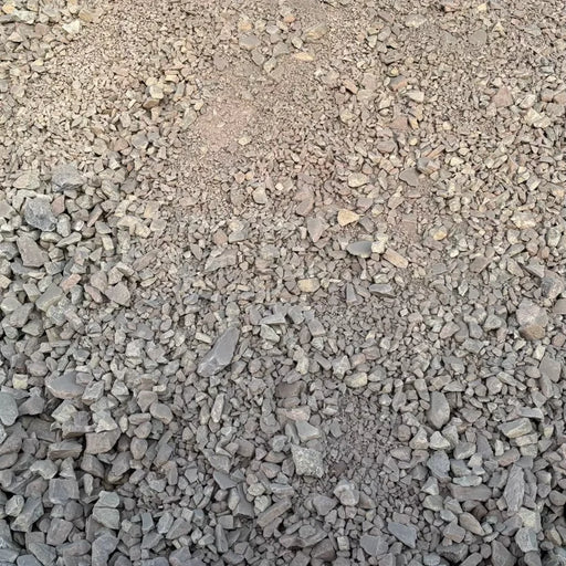 Close-up of small gravel stones on a brown background